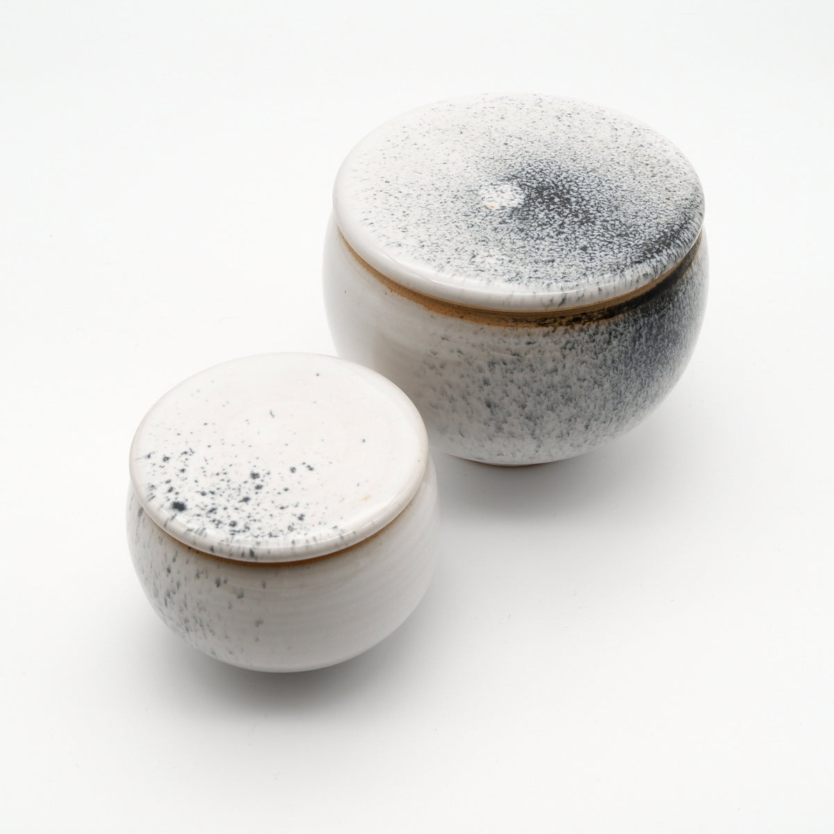 Two lidded jars XS and M